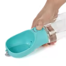 portable dog water bottle — in use with pet